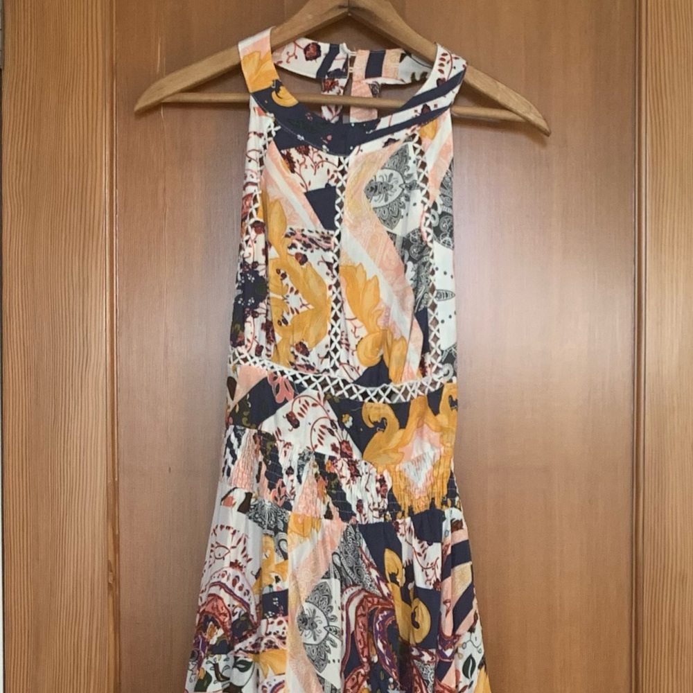 Flowing, high neck dress with pretty tie in back